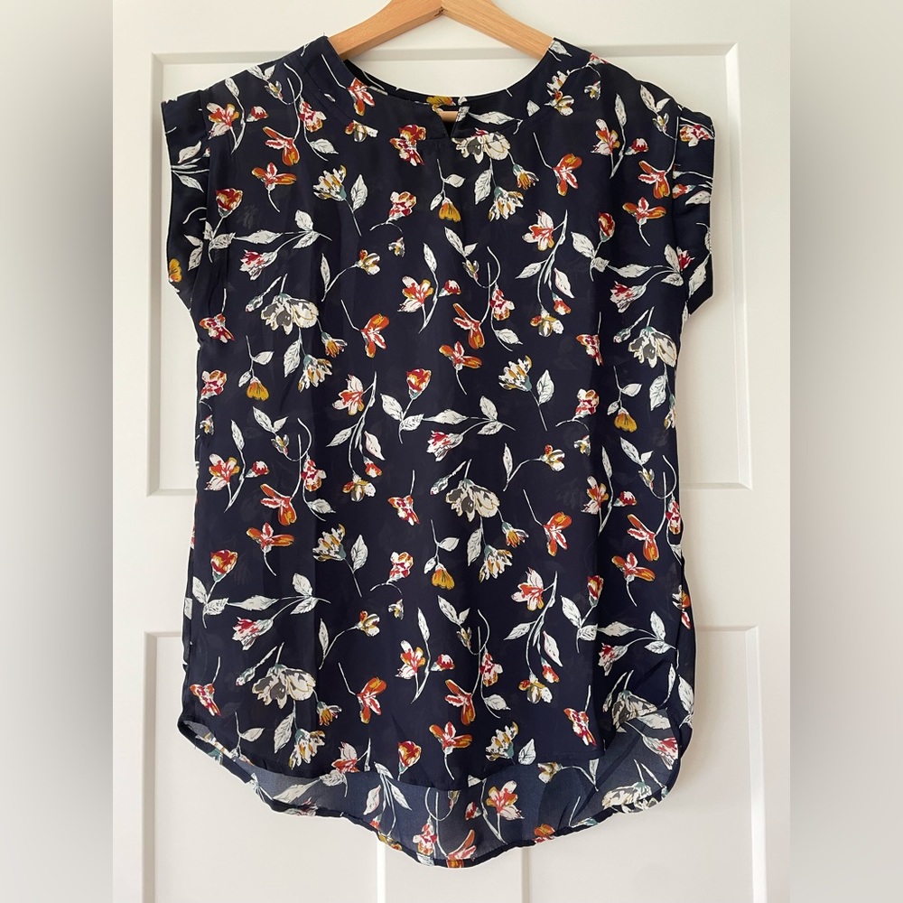 Navy blue flower print sheer top.